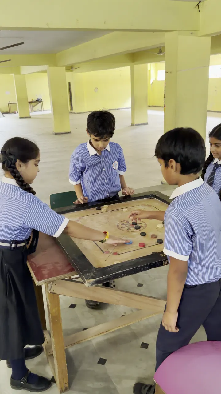 Students Playing Carrom in the Activity Hall