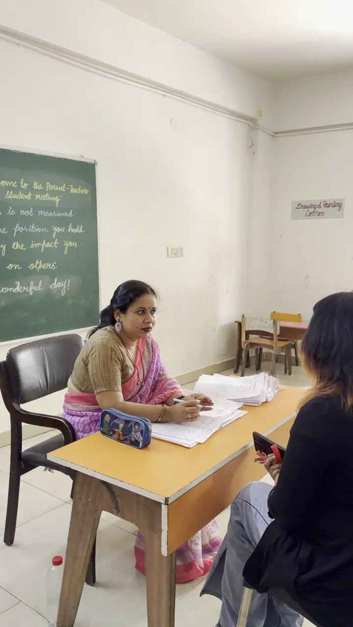 Teacher Guiding a Student